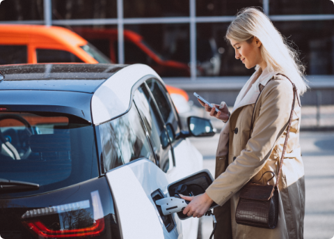 woman electric vehicle phone woman electric vehicle phone