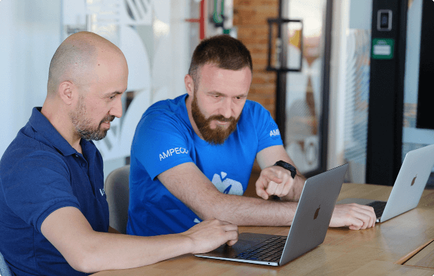 AMPECO employees working on a project